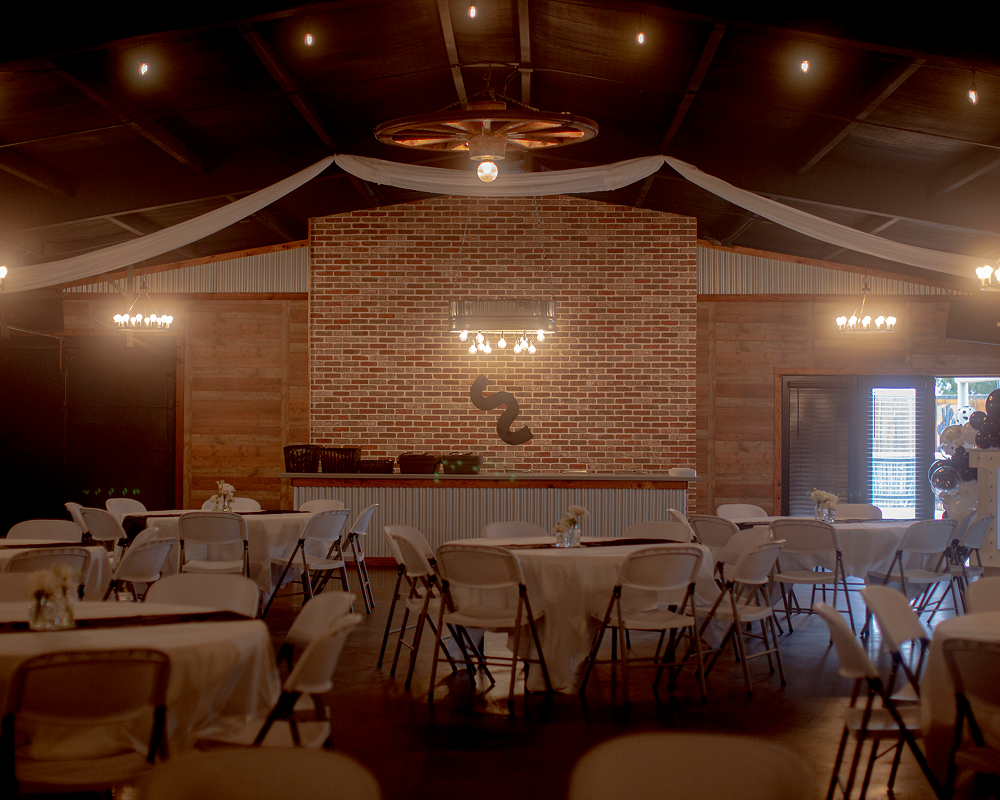 Cozy rustic restaurant with warm lighting and wooden decor.